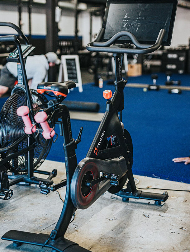 Peloton bike sitting in a gym